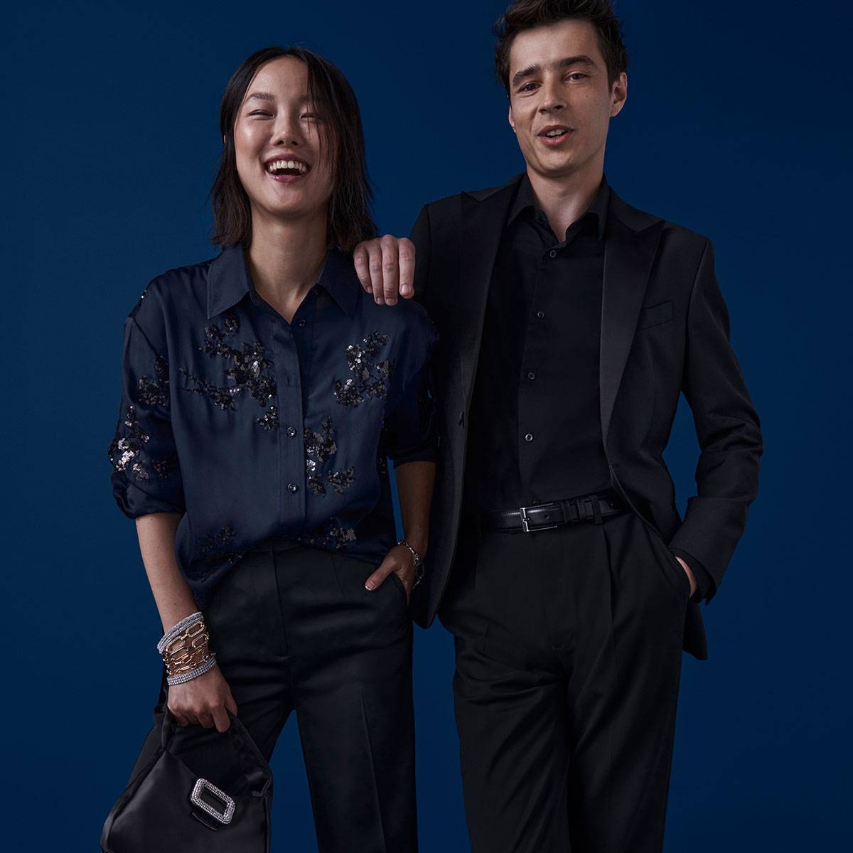 Woman and man dressed smartly in navy 